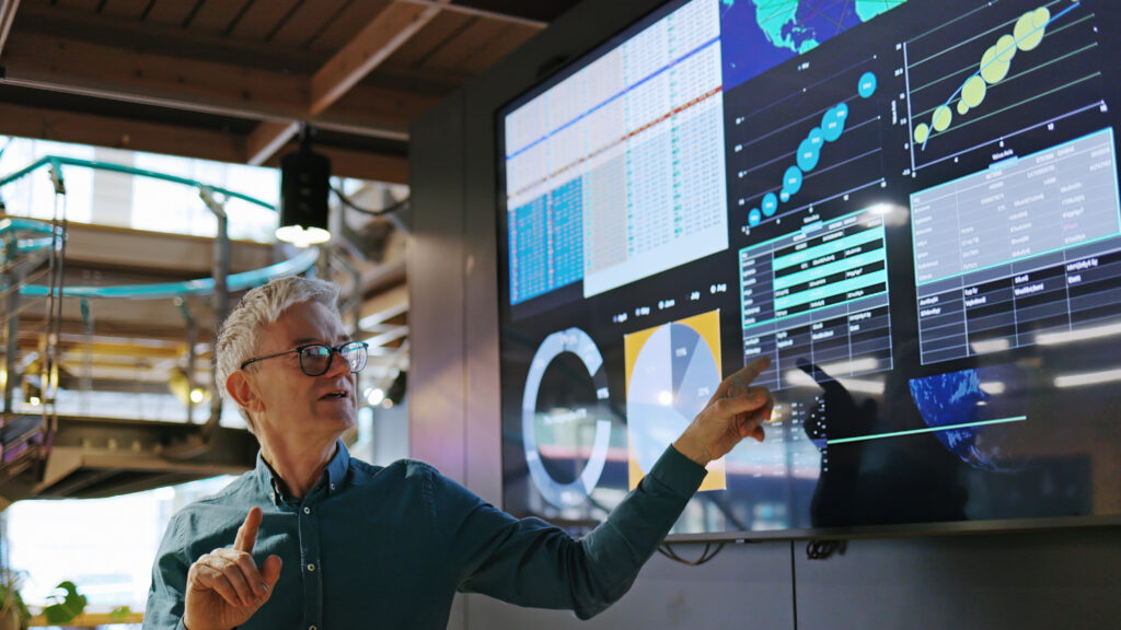 Man pointing to screen